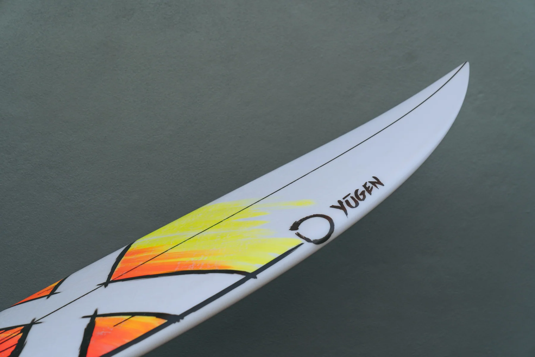 Yellow and orange custom artwork on a Yugen board