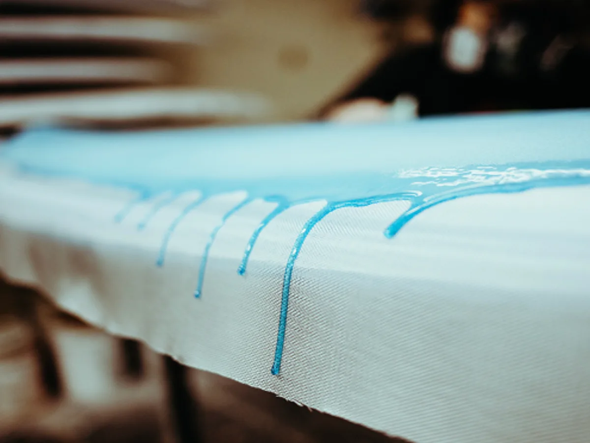 Foam blank being shaped by hand in the bay